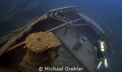 Sitting at a depth of 150-feet, a diver explores the ster... by Michael Grebler 